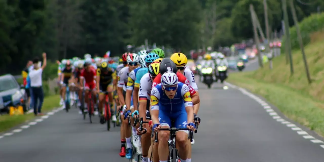 Why are there teams in the Tour de France?